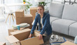 © StockPhotoPro - Happy woman moving in her new home