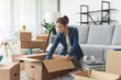 © StockPhotoPro - Woman unpacking in her new apartment