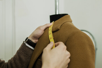 a tailor with a ribbon measure