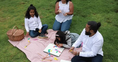 Poster - Indian parents having fun at city park doing picnic while playing with their children - Family, summer and love concept 