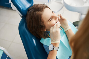 Sticker - Underage patient is undergoing teeth care procedure