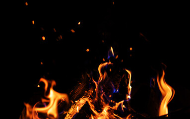 Bright burning flame of fire on a black background, beautiful abstract background and texture