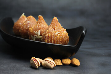 Besan ke ladoo or Motichur ke ladoo or Modak made from Chickpea flour,desi ghee and sugar during festival season like Diwali nad Ganesh chaturthi.