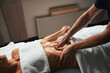 © Viacheslav Yakobchuk - Young beautiful woman under the towel relaxing stomach massage at spa salon