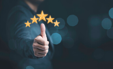 Poster - Businessman hand thumb rise up with yellow stars for customer satisfaction and product service evaluation concept.