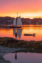 A Schooner Returns To Dock At Sunset At Bailey Island, Casco Bay, Maine