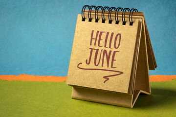 Poster - Hello June - handwriting in a desktop calendar against abstract paper landscape, cheerful greetings