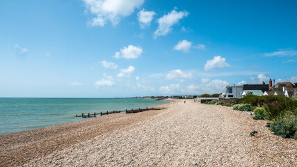 Summer at Pevensey Bay, East Essex, England. The pebble beach at Pevensey on the south east coast of England between Eastbourne and Bexhill.