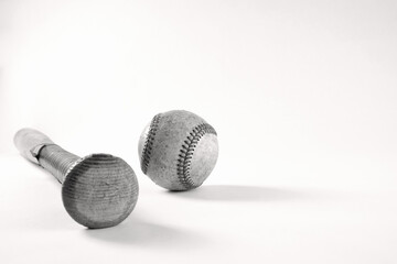 Wall Mural - Close up of old baseball wooden bat with used ball isolated on retro white background for sport.
