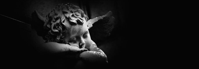 Fototapete - Ancient statue of  little Dreaming Angel. Copy space for design.