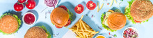 Fastfood, Burger Party Concept. Various Delicious Burgers Set With French Fries And Sauces On Bright Blue Background Flatlay Top View Copy Space