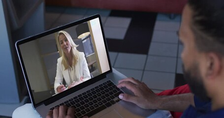 Sticker - Middle eastern man having a video call with female colleague on laptop