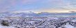 Panoramic aerial view of the Utah valley with buildings covered by snow