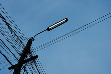 old electric pole and street light.