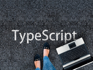 Poster - TypeScript Programming Language. Legs in sneakers standing next to laptop and word TypeScript
