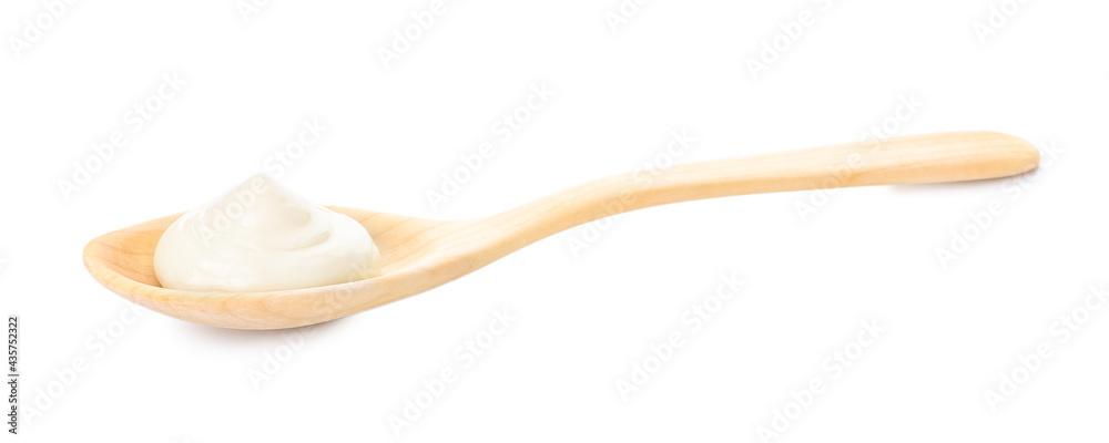 Spoon with tasty mayonnaise on white background