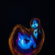 Amorphous and colorful isolated soap bubble with black background.