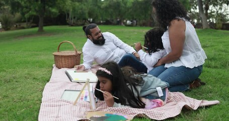 Poster - Indian parents having fun at city park playing with their children - Family, summer and love concept