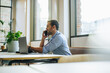© Jacob Lund - Executive talking on cell phone