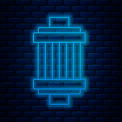 Poster - Glowing neon line Car air filter icon isolated on brick wall background. Automobile repair service symbol. Vector