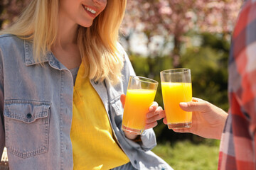 Poster - Happy couple having picnic in park on sunny day, closeup