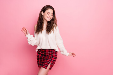 Wall Mural - Portrait of pretty cheerful girl beaming smile have fun partying clubbing isolated on pink color background