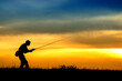 © Mihai - Silhouette of fisherman in sunset.