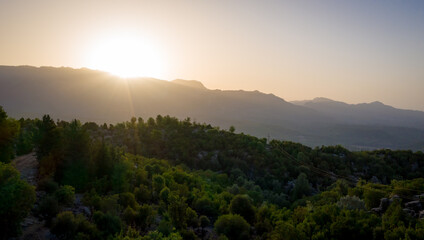 Morning landscape just after sunrise. The sun's rays fall on the mountain valley. Aerial view of Canyonlands National Park near ancient city of Selge Adam Kayalar, Turkey. Koprulu Canyon.