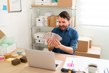 Wall Mural - Hispanic entrepreneur earning a lot of money