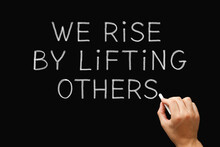 We Rise By Lifting Others Teamwork Concept