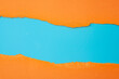 Horizontal border and colorful backgrounds concept with torn orange paper and copy space on blue background