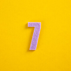 A colorful number on yellow background