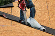 Roofer Uses Blower on Roof Decking