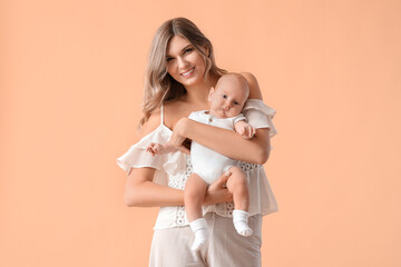 Wall Mural - Happy mother with cute little baby on color background