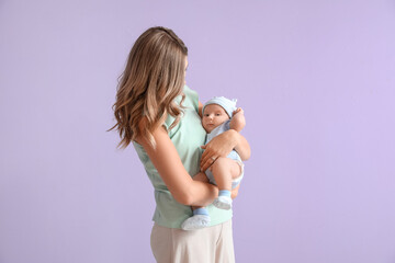 Wall Mural - Happy mother with cute little baby on color background