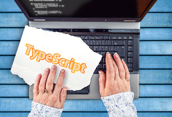 Poster - TypeScript Programming Language. Word TypeScript on paper and laptop 