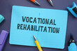 Conceptual photo about Vocational Rehabilitation with handwritten phrase.
