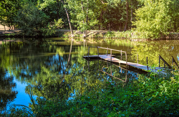 Canvas Print - Summer forest lake and tarry wooden pier