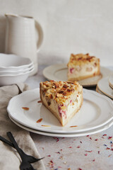 Sticker - Closeup shot of delicious rhubarb cheese pie on a plate on a white table