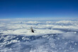 © A - Flying helicopter on the background of clouds and blue sky