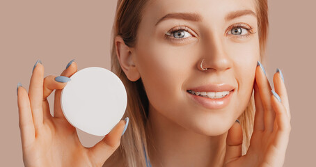 Wall Mural - girl make face beauty masks. anti-wrinkle cream for the freshness of the skin around the eyes. woman