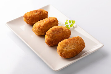 Wall Mural - Tapa of croquetas, typical spanish dish, on white background