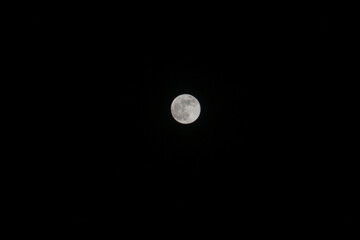 moon in the sky with wide dark night background