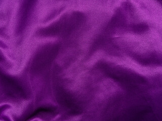 purple silk fabric texture top view. violet background. fashion trendy color feminine satin dress fl