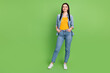 Full size photo of young charming pretty positive girl look copyspace dreaming isolated on green color background