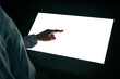 © zyabich - Woman hand using white blank interactive touchscreen display of electronic multimedia kiosk in dark room - scrolling and touching - close up view. Mock up, copyspace, template and technology concept