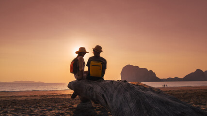 Romantic couple traveler joy look beautiful nature at sunset Pak Meng beach Outdoor lifestyle attraction travel Trang Thailand exotic beach Tourist on summer holiday vacation, Tourism destination Asia