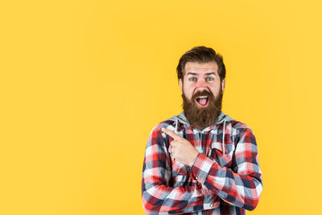 Wall Mural - well groomed hairstyle. male beauty and fashion look. hipster checkered shirt for bearded guy. unshaven brutal man with beard. hairdresser concept. mature and confident
