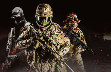 Wall Mural - Photo of fully equipped soldiers in heavy level 3 armor ammunition, swat clothing and guillie suit squad standing on dark destructed city background.