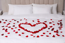 Beautiful Heart Of Red Rose Petals On Bed